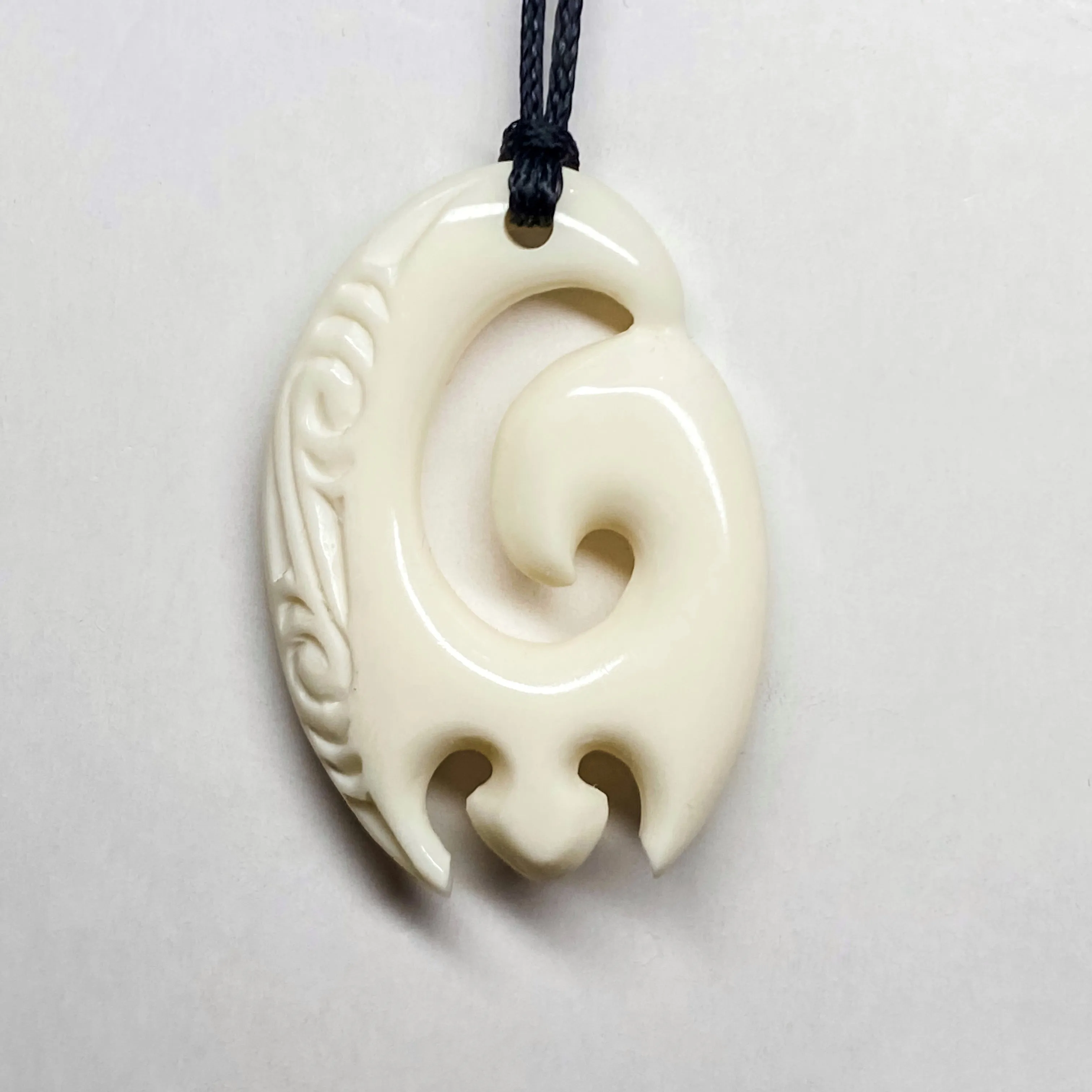 Handcarved Bone Enclosed Koru Pendant